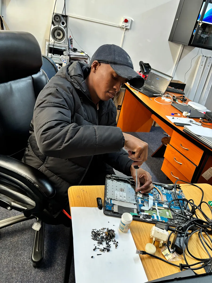 UXPERT carrying out hands-on laptop hardware repairs