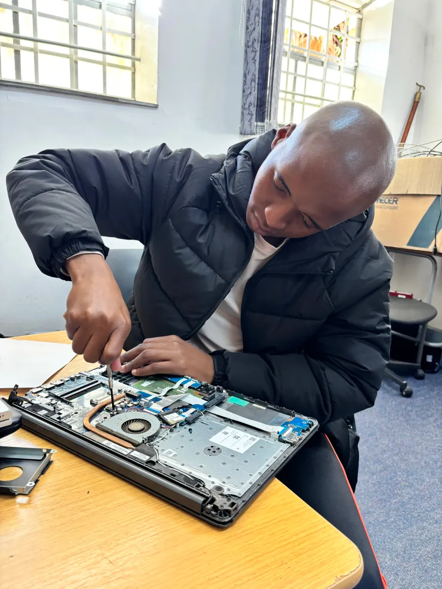 UXPERT working on laptop cooling and internal components